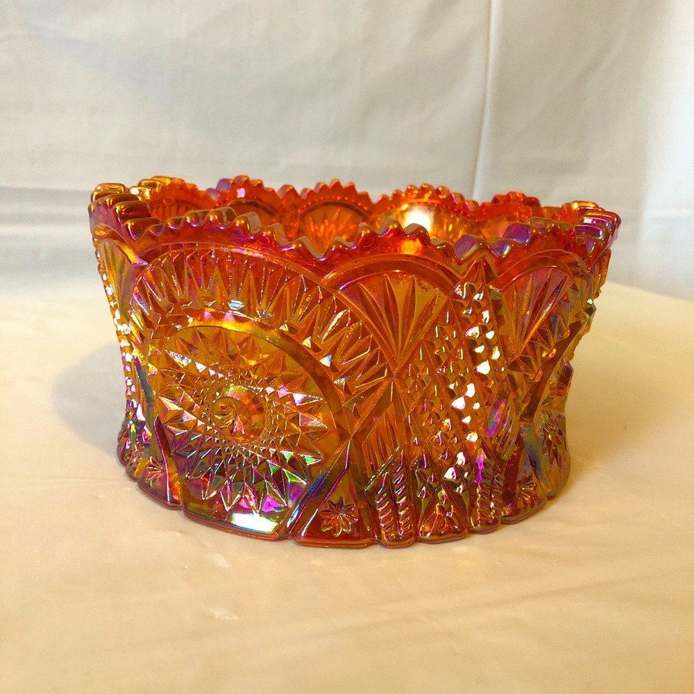 Carnival glass sawtooth bowl with starburst motif